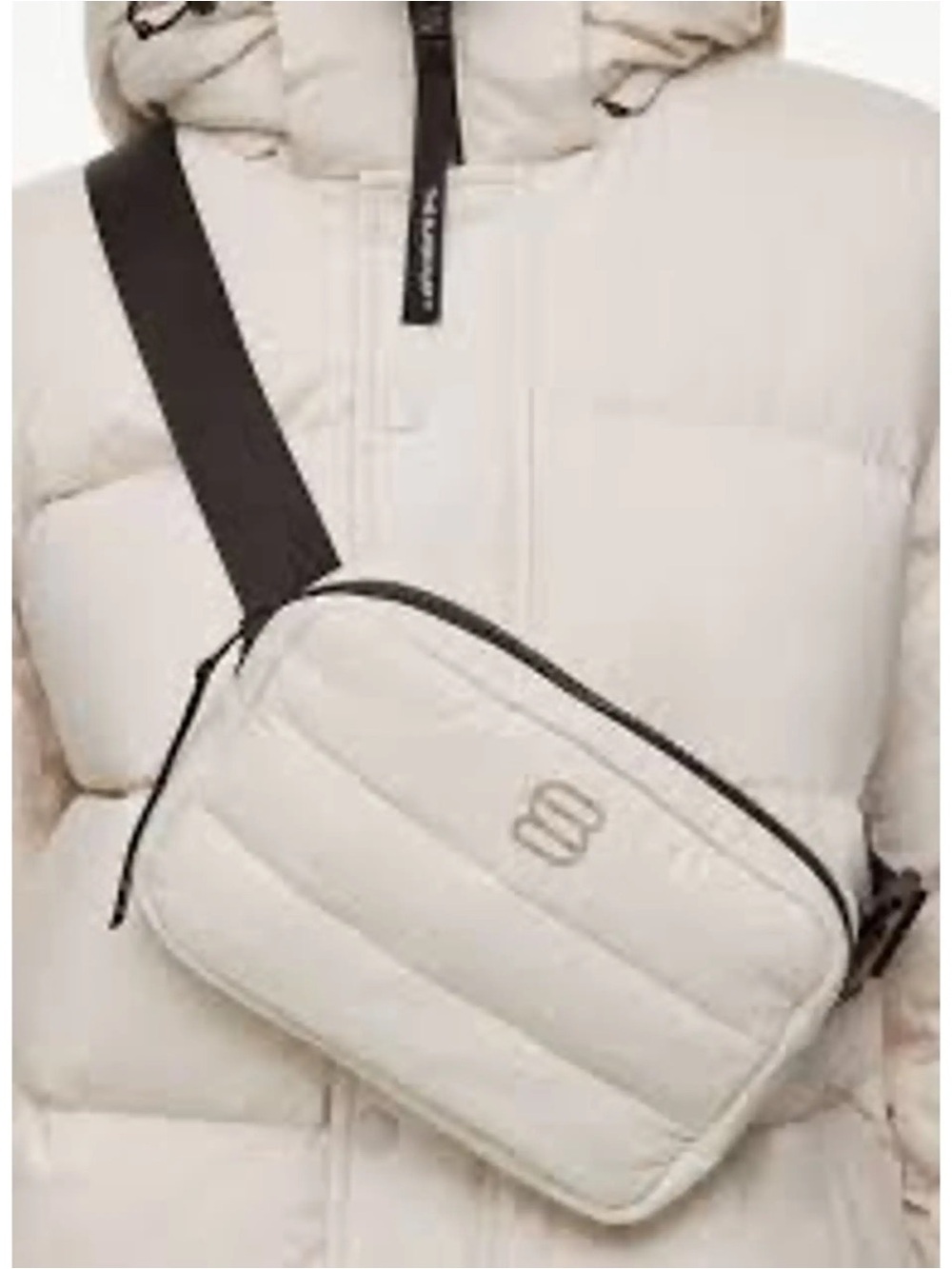 NWT Aritzia Super Puff™ Bag in a matte cream finish featuring a quilted design.